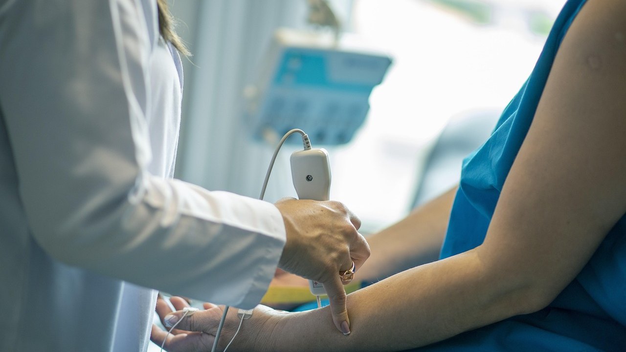 doctor reviewing liver ultrasound scan in clinic