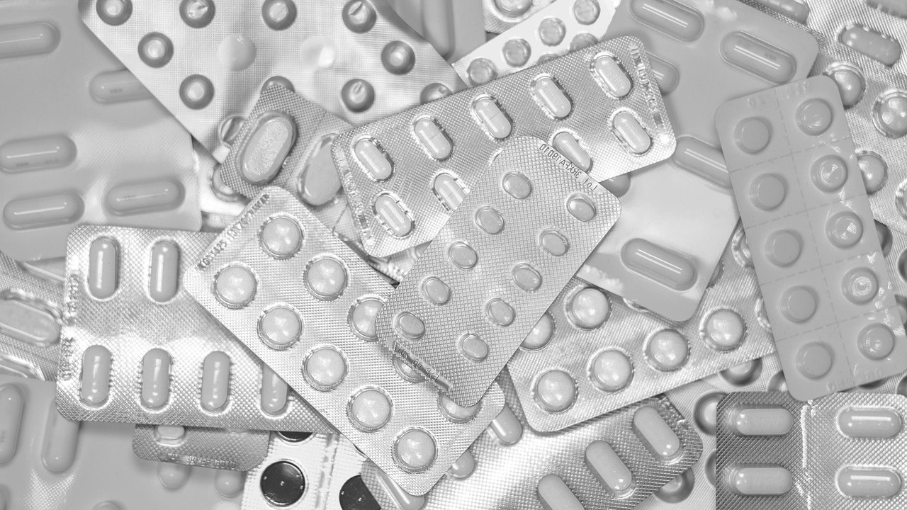 cholesterol medication pills on table