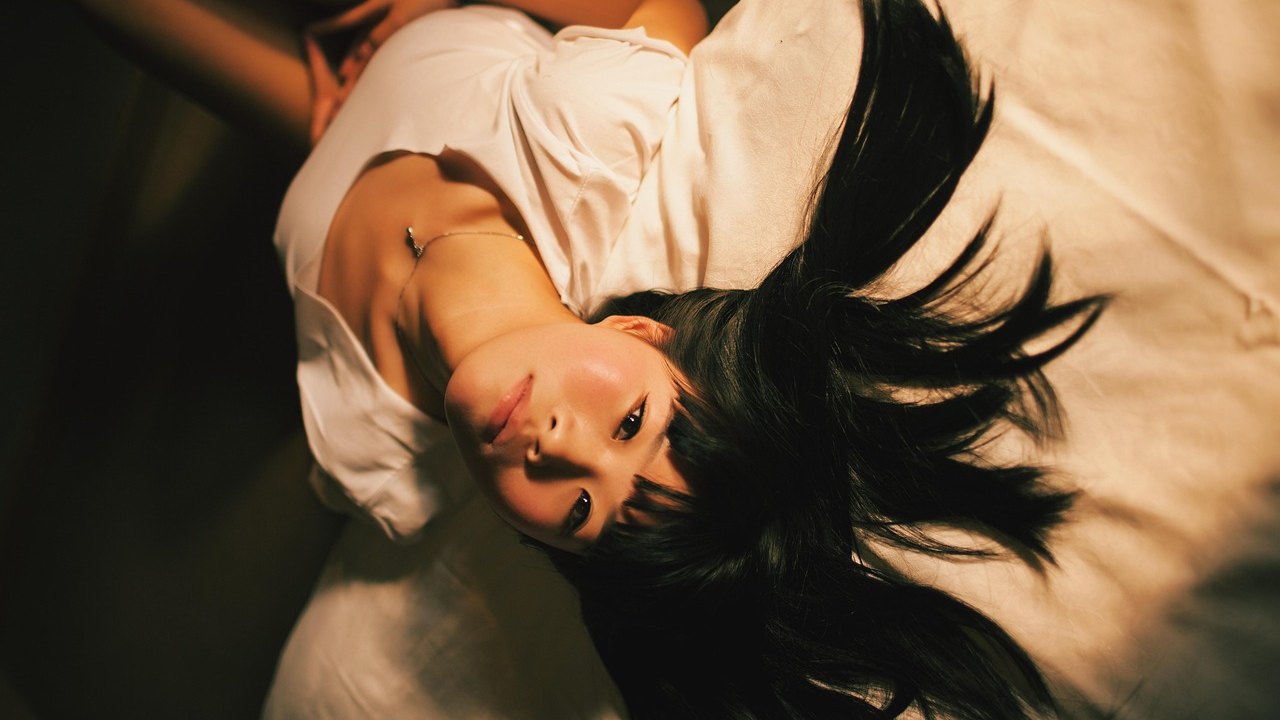 person sleeping in bed at night