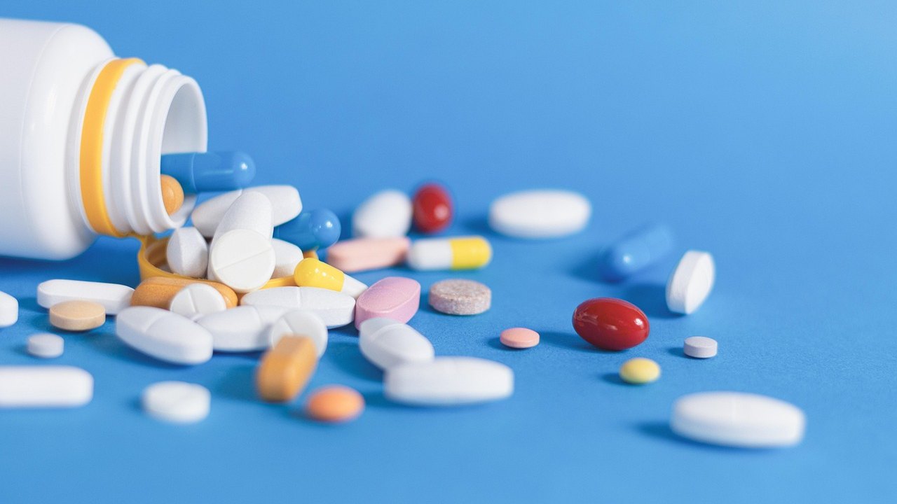 pill organizer with anticoagulant tablets on table