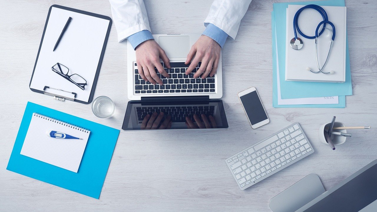 doctor reviewing medical documents in clinic