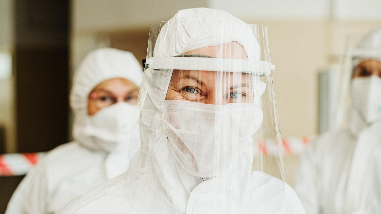 healthcare workers in protective suits