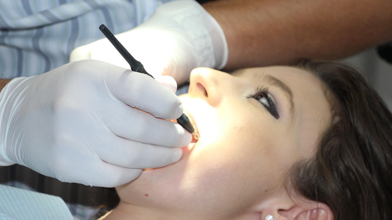 dentist applying liquid to tooth