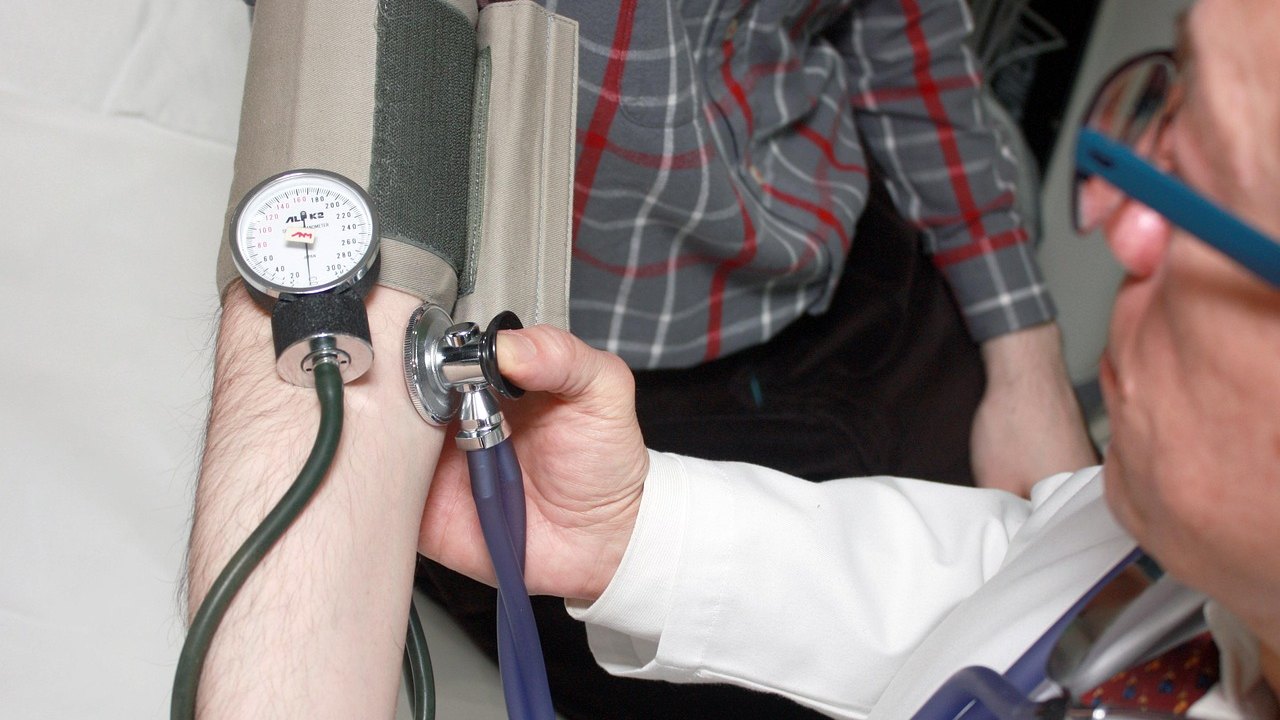 doctor measuring blood pressure