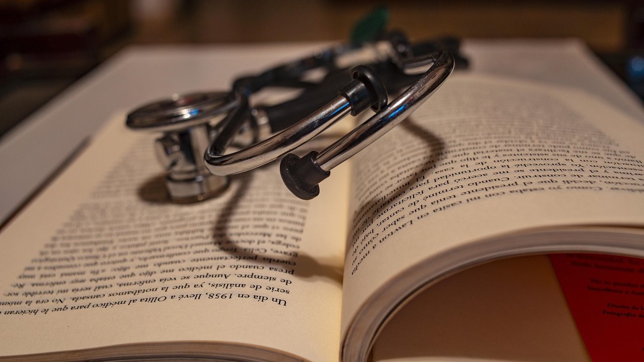 doctor studying medical textbook