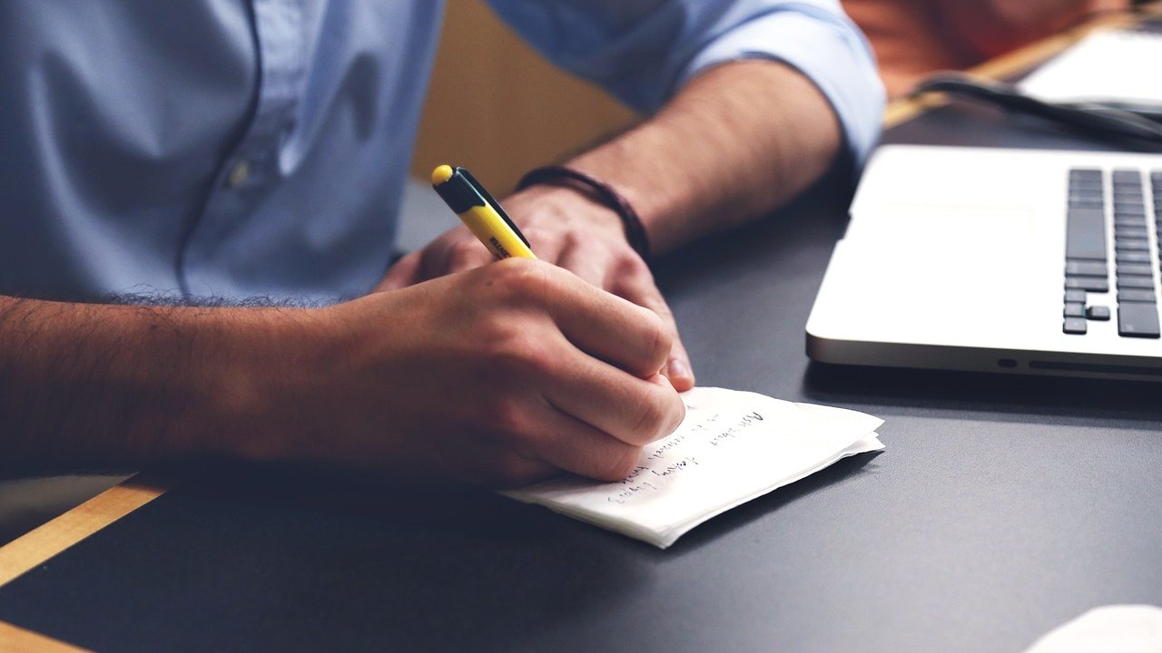 doctor reviewing cardiology notes at desk