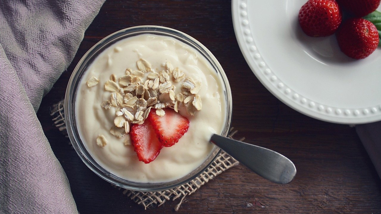 bowl of yogurt with fiber powder on breakfast table