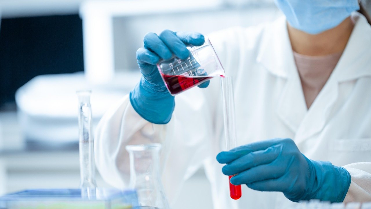laboratory scientist pipetting samples