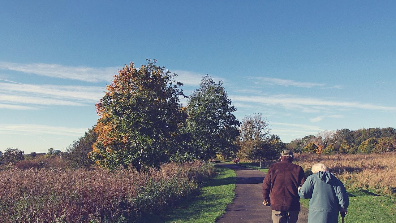 elderly woman walking outdoors