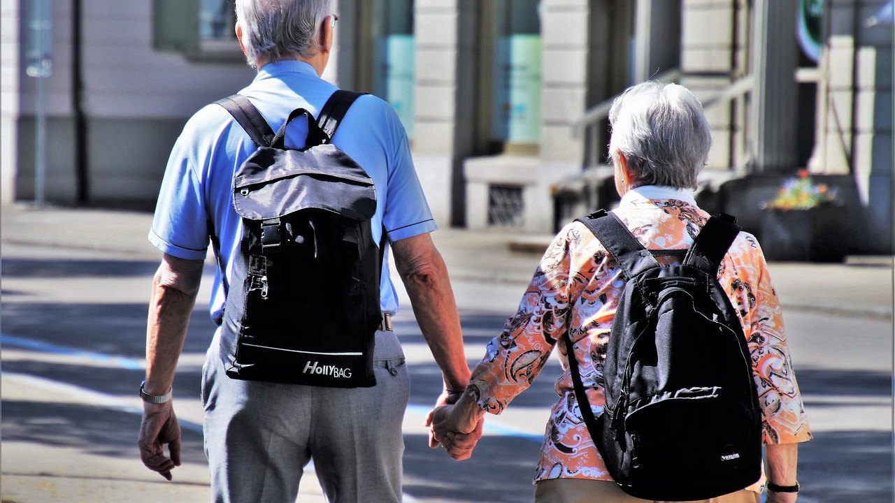 elderly people walking in park